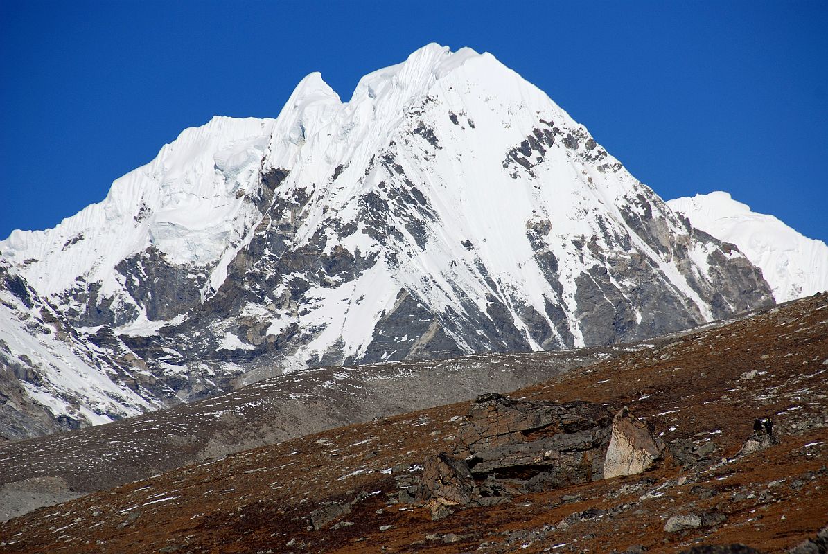 19 Goldum Close Up As Trek Nears Shishapangma Advanced Base Camp Goldum (6630m) close up as the trek nears Shishapangma Southwest Advanced Base Camp. The mountain poking out on the right is Langtang Ri (7239m).